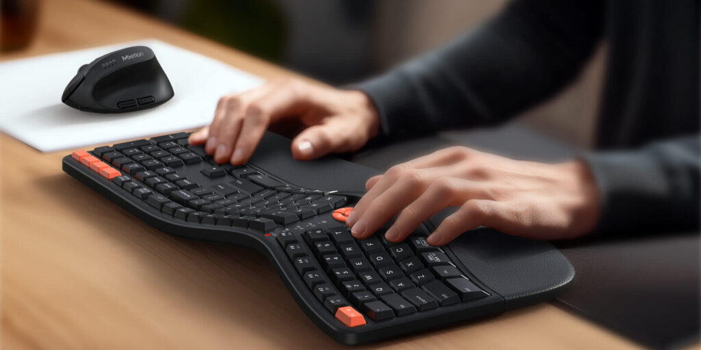 man typing on ergonomic keyboard